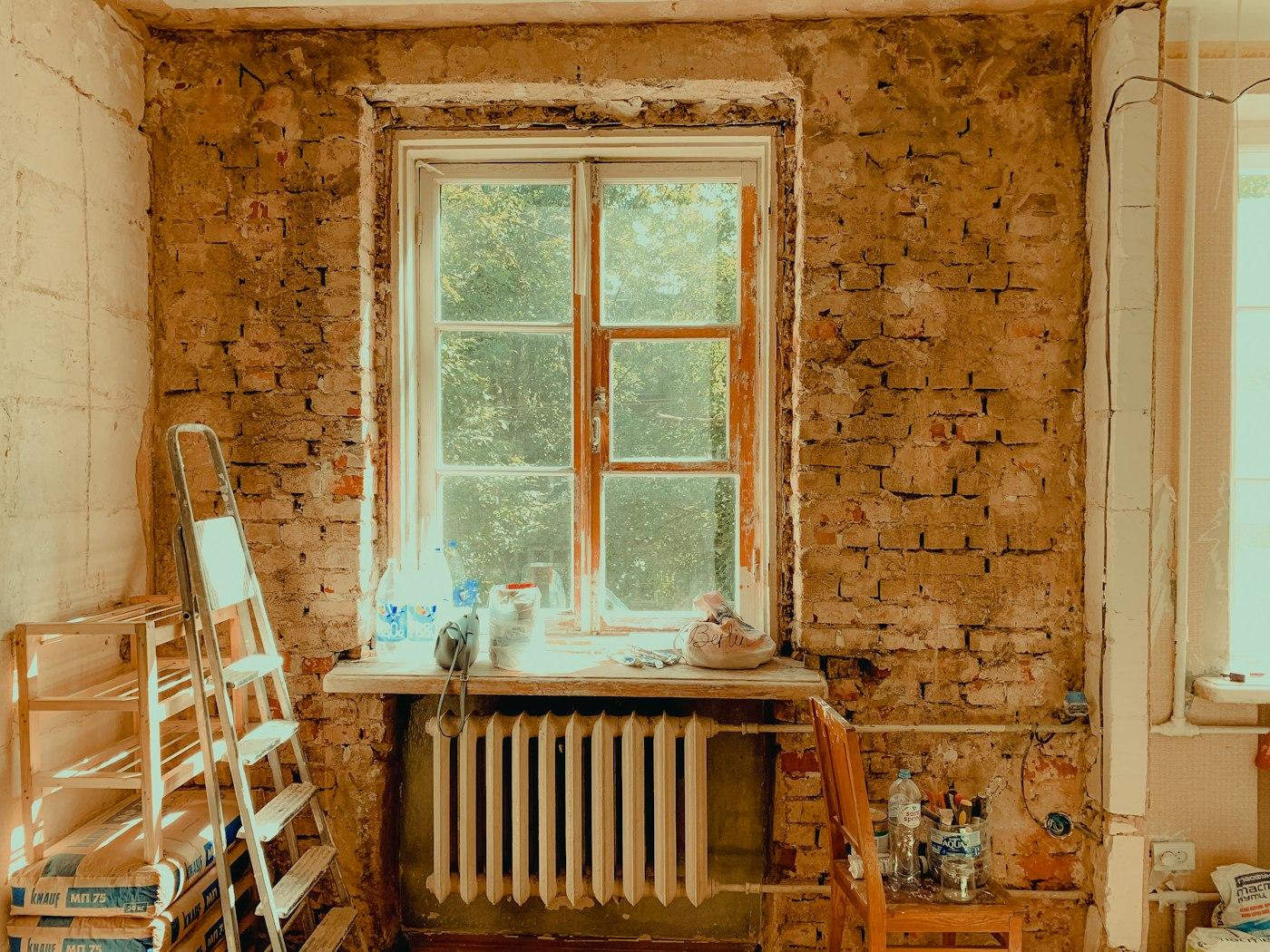 A room stripped back to the plaster during renovation