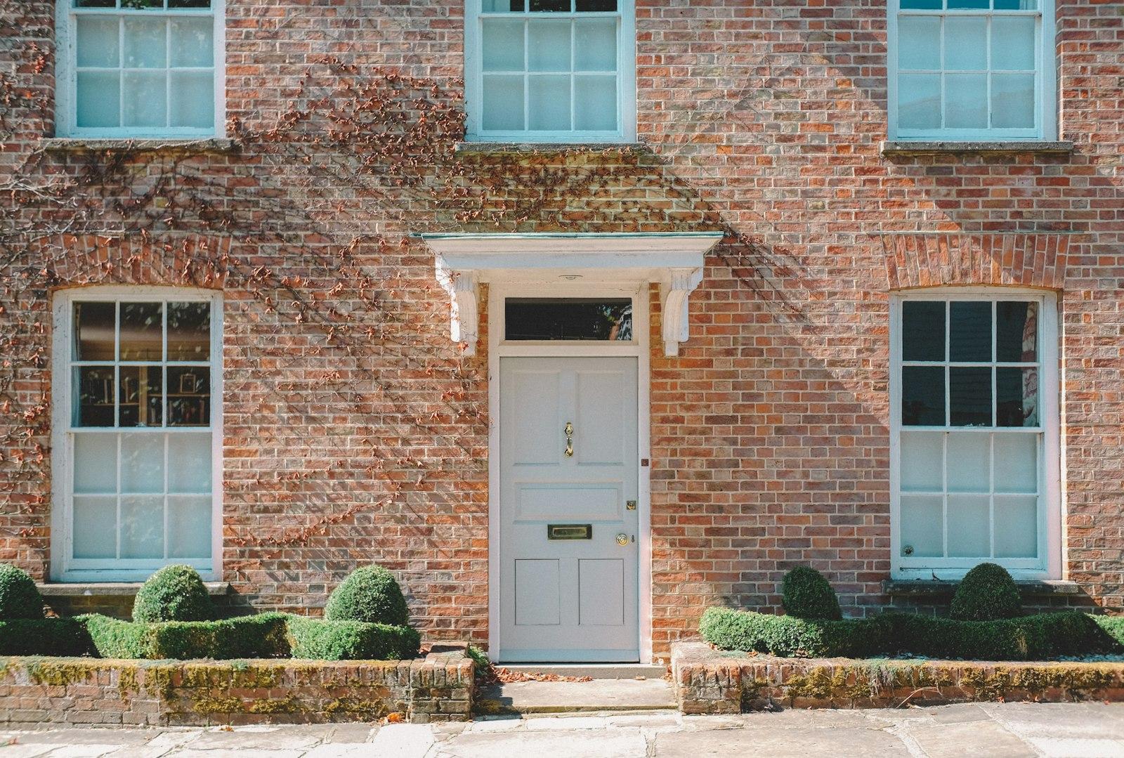The front door of a red-brick house